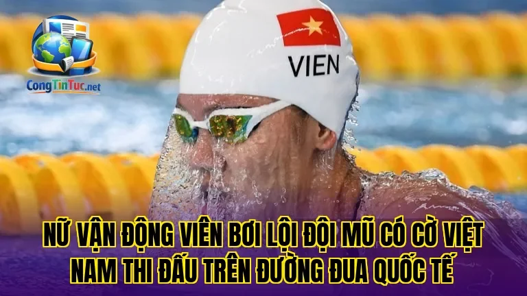 Nữ vận động viên bơi lội đội mũ có cờ Việt Nam thi đấu trên đường đua quốc tế